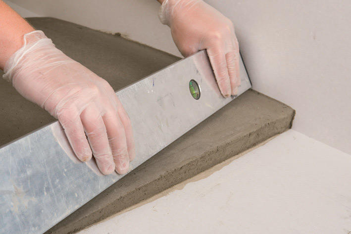 Качество уложенной плитки во многом зависит от правильной подготовки поверхности